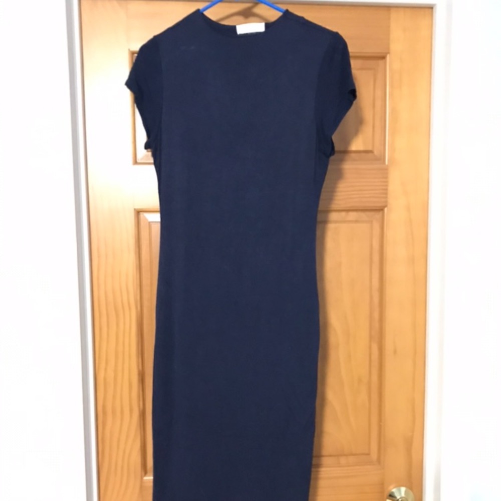 NWOT Navy bodycon dress. Short sleeved. never worn